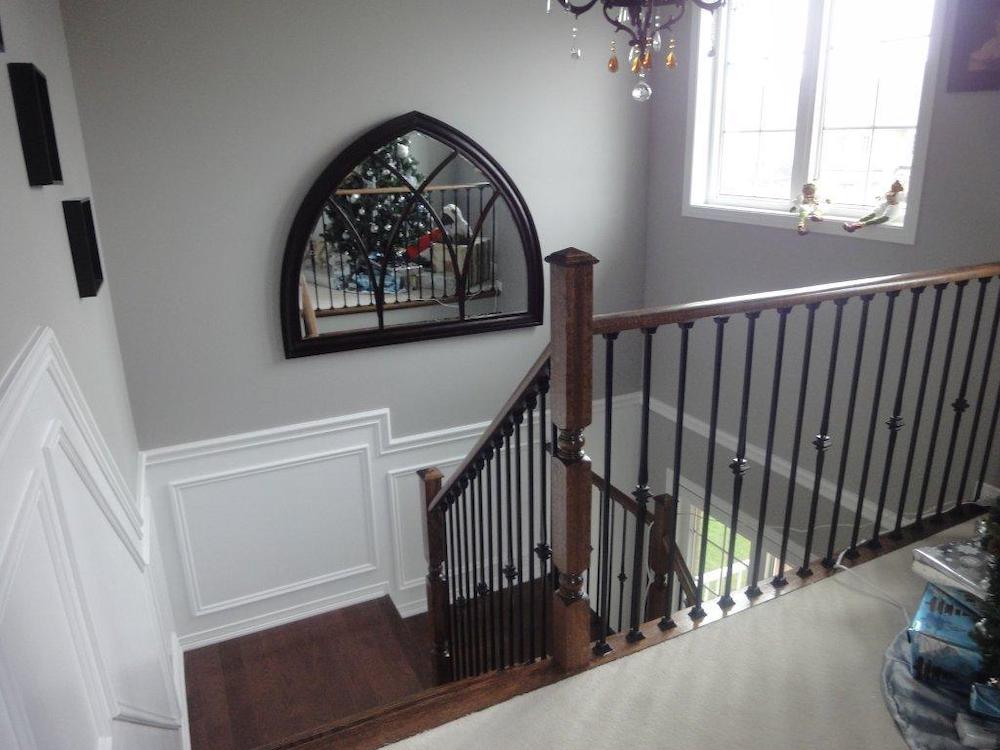 Wainscoting made with applique around stairs
