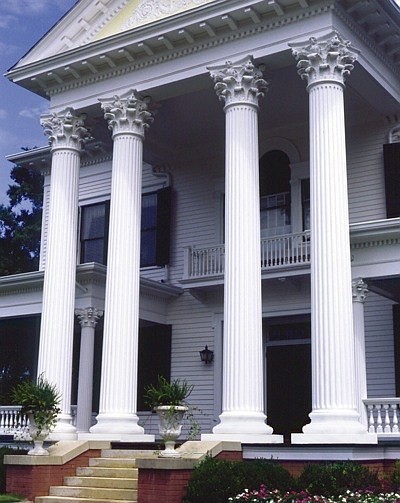 Large fluted columns with corinthian style capitals