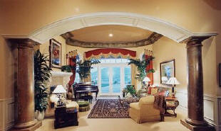 Large interior round hardwood columns framing living room