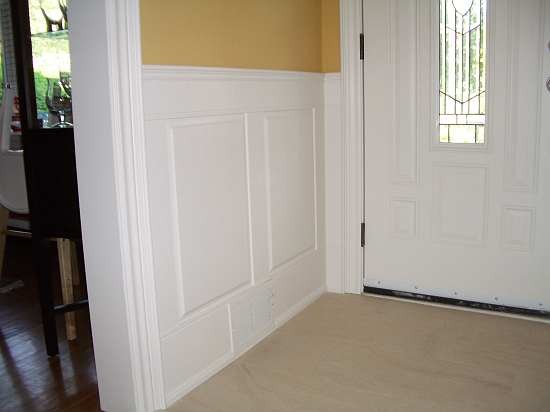 Raised panelled wainscoting in hallway entrance