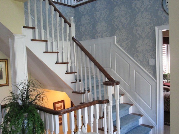 Raised panel wainscoting angled up stairs