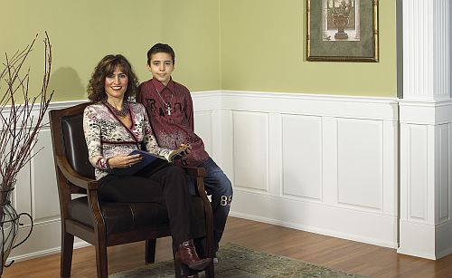 Raised panel wainscoting behind a family photo