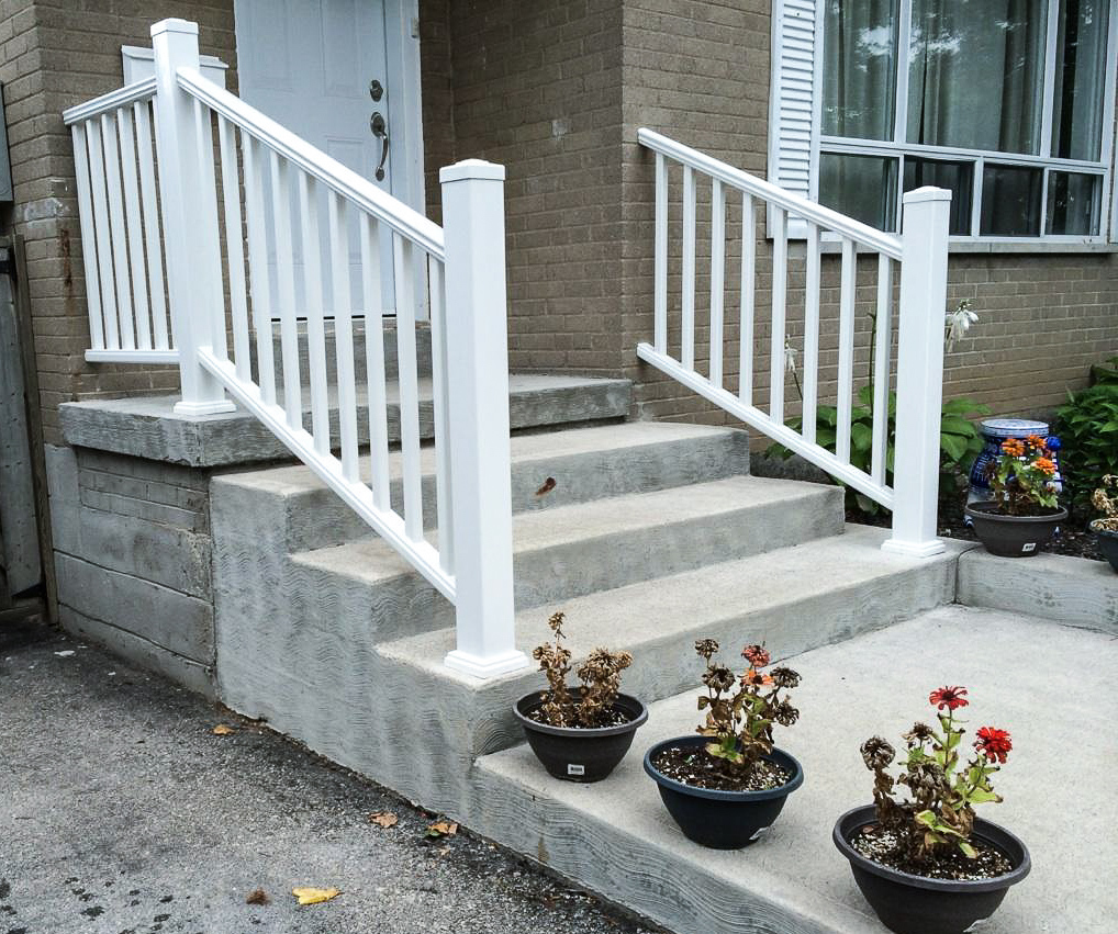 Simple square newel posts with railings on stairs