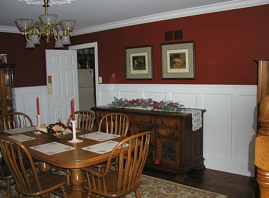 Tall wainscoting sans panels in against a painted wall