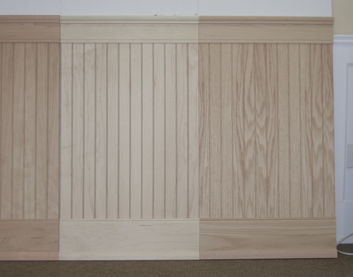 Three samples showing the difference between unfinished red oak, maple and cherry hardwood beadboard