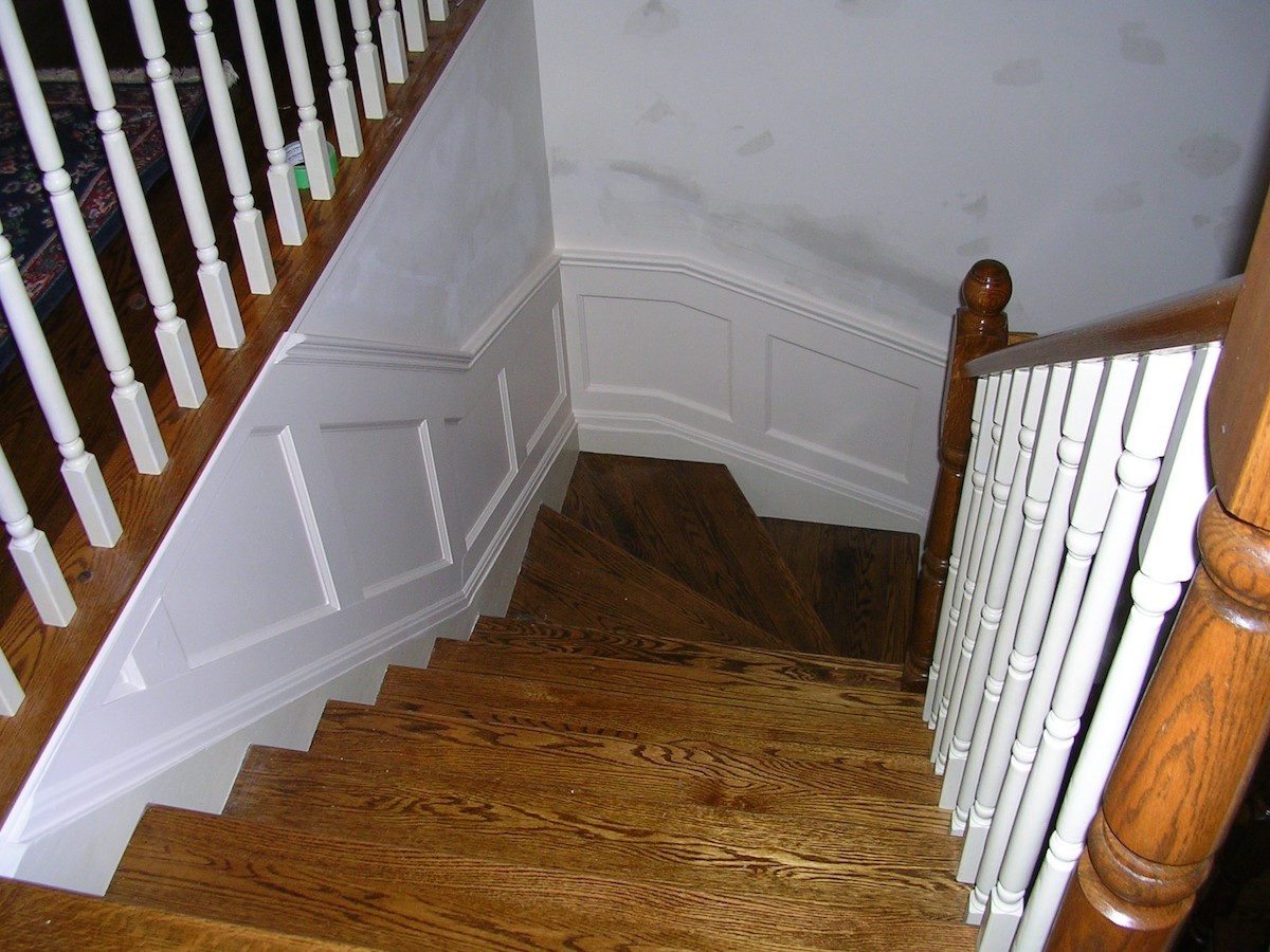 Recessed panelled wainscoting along stairs