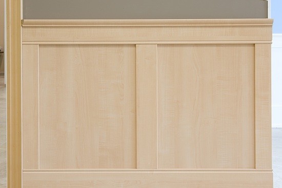 Example of flat panel prefinished wainscoting kits installed on a wall