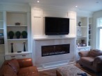 Panelled wainscoting used to create an accent wall in living room