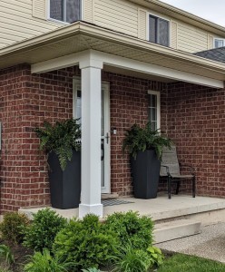 Quarter view of installed classic non-tapered pvc column wrap on front porch