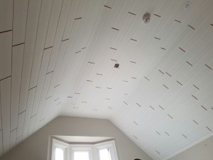 Shiplap planks installed on a ceiling