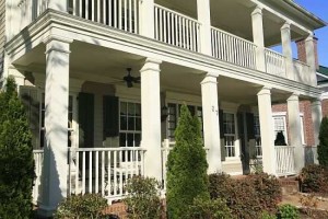 Installed square fibreglass columns on porch with railing