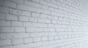 An angled look at the brick wall panels in white