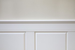 A close up of raised panel wainscoting