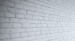 An angled look at the brick wall panels in white