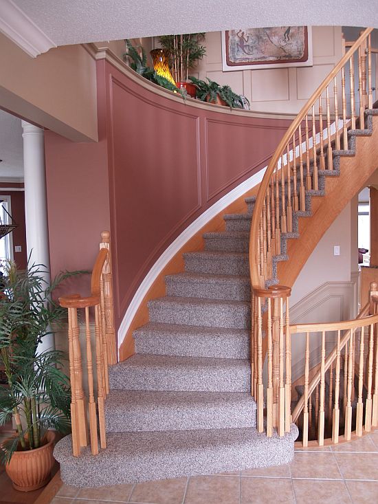 Accent walls around stairs made up of applique and wainscoting