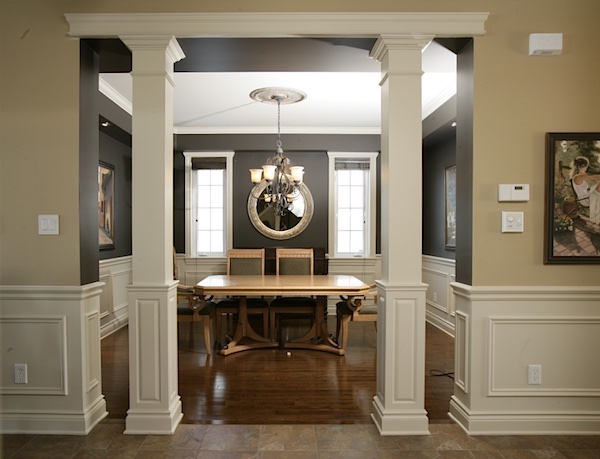 Half panelled square interior columns framing entrance to dining room