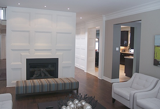 Panelled wainscoting making an accent wall in living room