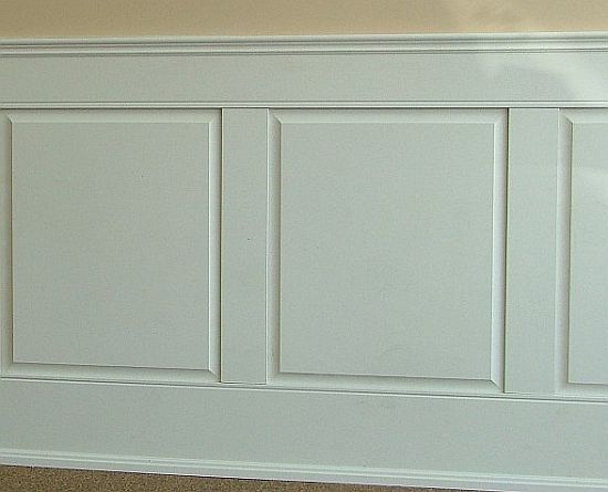 Raised panel wainscoting installed against a wall