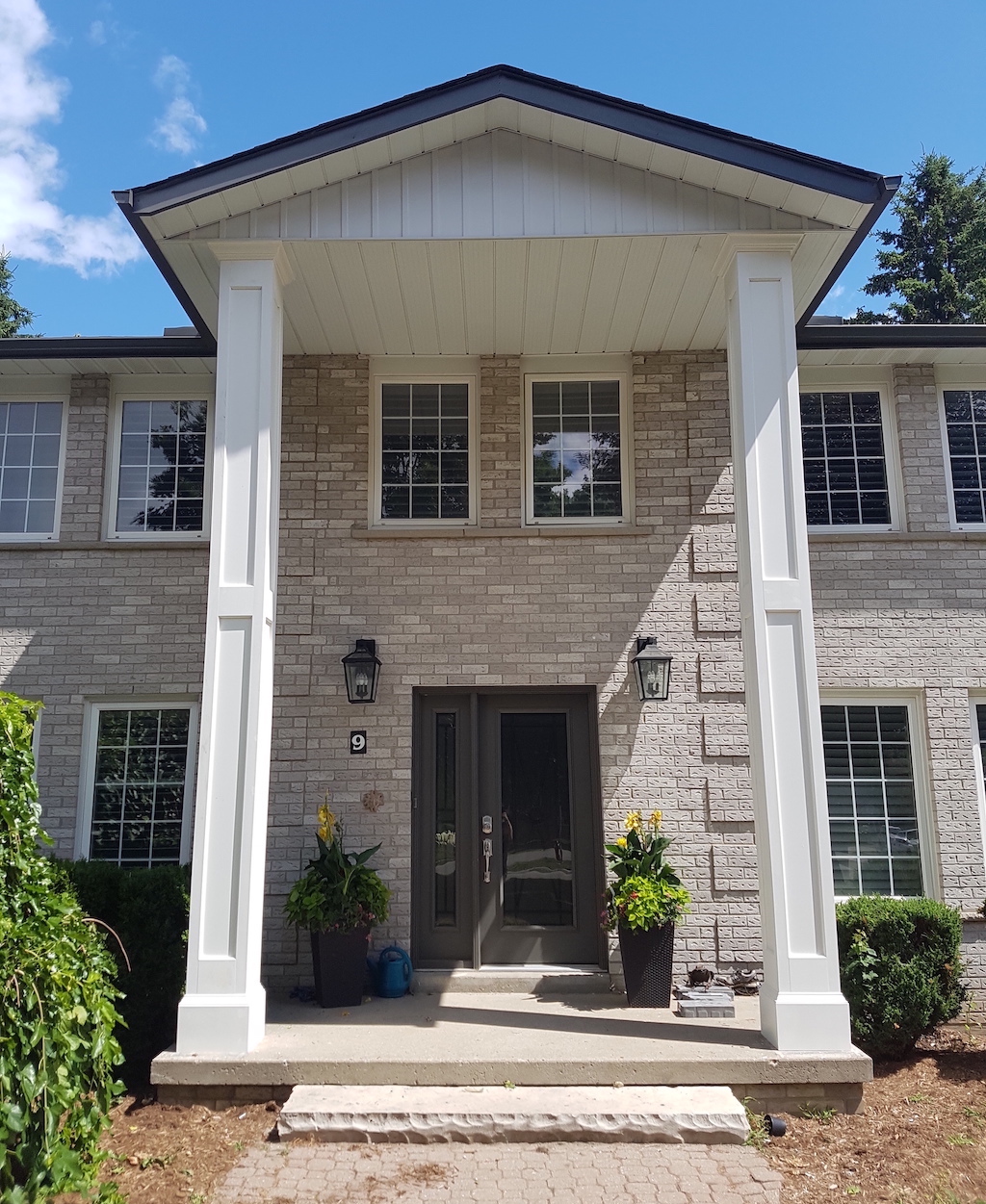 Tall panelled PVC column wraps on front porch
