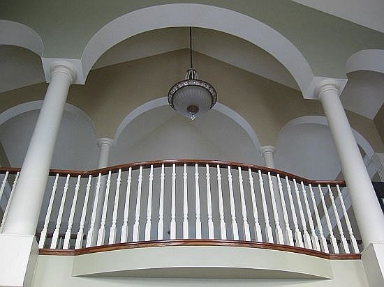 White painted supportive interior wood columns