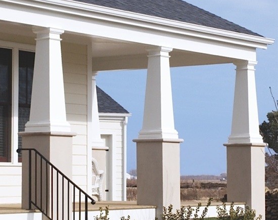 3 White tapered PVC column wraps on front porch