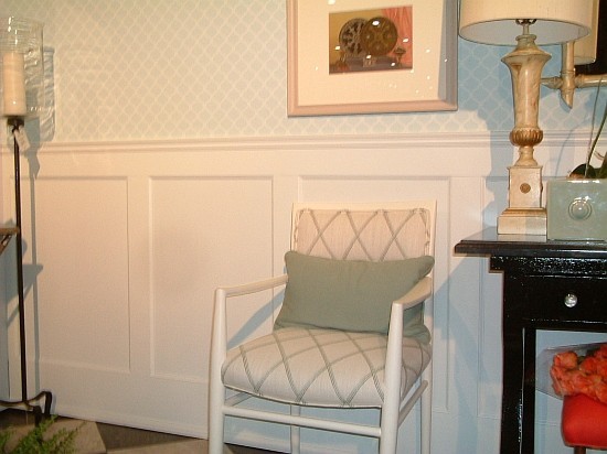 White Wainscoting with patterned wallpaper above it