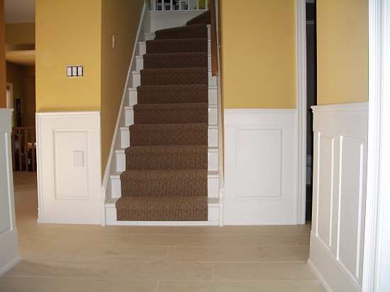 Raised panel wainscoting installed against a painted wall